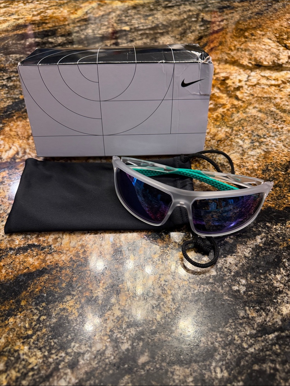 Nike Frosted Clear Frame Sport Sunglasses with Teal Arms and Mirrored Lenses